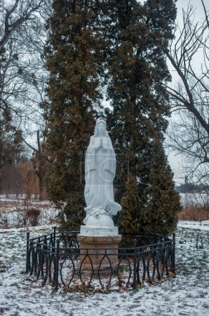 Photo for Sculpture of the Virgin Mary on Mary Island in Oleksandriya park, Bila Tserkva, Ukraine. - Royalty Free Image