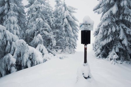 Photo for Kukul mountain sign post on the snow-covered winter hill - Royalty Free Image