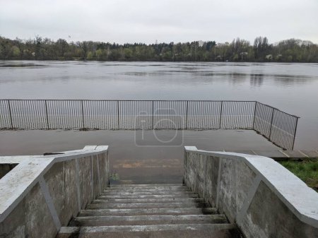 Photo for City park flooded with water after overflowed of the river - Royalty Free Image
