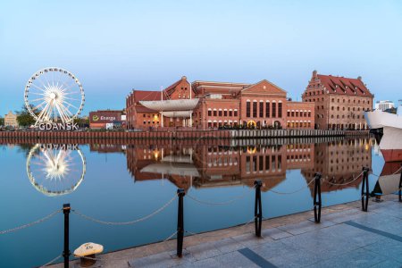 Photo for Ferris wheel near the Motlawa river at dusk in Gdansk Poland - Royalty Free Image