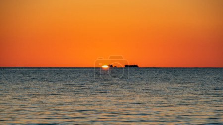 Puesta de sol desde Long Point con la puesta de sol sobre The Sisters, Port Kennedy - Rockingham