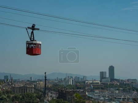 Photo for Red cable car over barcelona, view of the city from above - Royalty Free Image