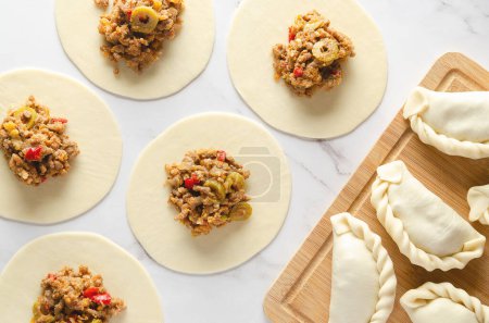 The process of making Argentinian beef empanadas.
