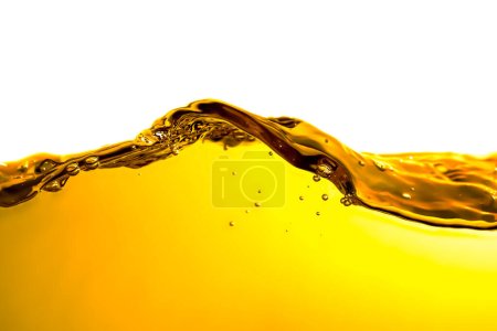 orange juice is isolated on white background. healthy fresh drink and natural waves. close up view.