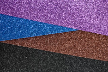 Photo for Violet, blue brown and black glitter sheets arranged in an angle, soft focus texture - Royalty Free Image