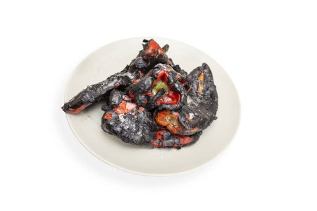 Photo for Roasted red kapia peppers on a gray ceramic plate isolated on white background - Royalty Free Image