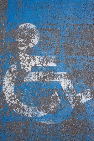 Photo for Sign on a parking lot space reserved for people with physical disabilities, abstract texture - Royalty Free Image