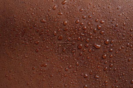 Photo for Water drops on red brown leather texture, soft focus close up pattern - Royalty Free Image