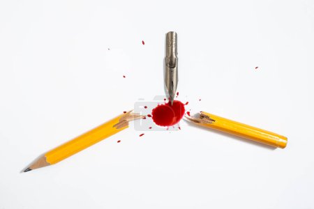 Steel pen nib snapping in half a wooden crayon and staining with blood like red ink the white background