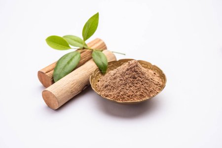 Photo for Chandan or sandalwood powder with sticks, perfume or oil which retain their fragrance for decades - Royalty Free Image