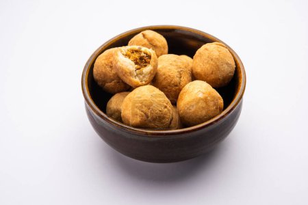 Photo for Dry kachori is a dry fruits stuffed ball shaped farsan also called kachauri, kachodi and katchuri - Royalty Free Image