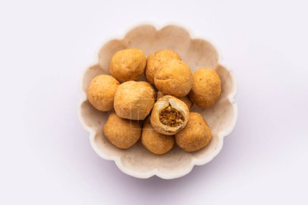 Photo for Dry kachori is a dry fruits stuffed ball shaped farsan also called kachauri, kachodi and katchuri - Royalty Free Image