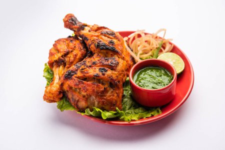 Téléchargez les photos : Tandoori Chicken est une nourriture épicée indienne non végétarienne - en image libre de droit