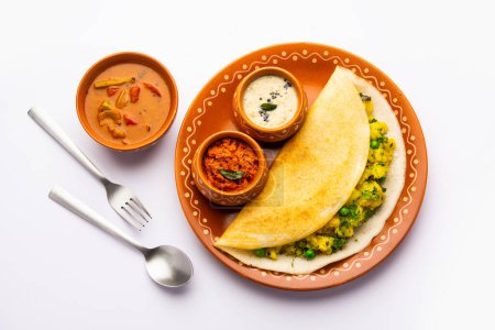 Photo for A dosa, also called dosai, dosey, or dosha, is a thin pancake in South Indian cuisine - Royalty Free Image