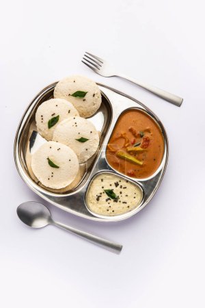 Photo for Idly sambar or Idli with Sambhar and green, red chutney. Popular South indian breakfast - Royalty Free Image
