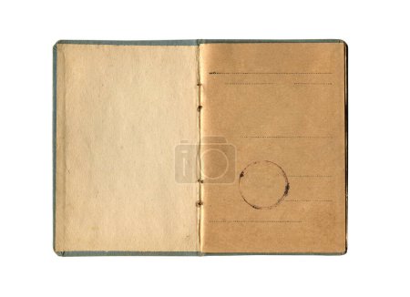 front view closeup detail of small old notebook with vintage yellow brown paper and seal stamp and empty first page open and isolated on white 