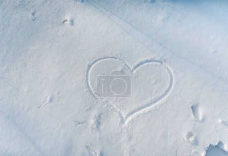 Photo for Heart drawn in the snow. Love winter. Walk in the winter forest. - Royalty Free Image