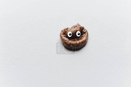 Photo for Poop emoticon on white background. Minimal concept. - Royalty Free Image