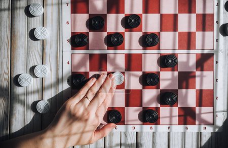 Photo for Man in a losing situation. Don't give up concept. Checkers game. - Royalty Free Image