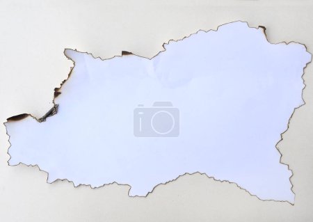 Photo for Burnt white paper on cream background - Royalty Free Image
