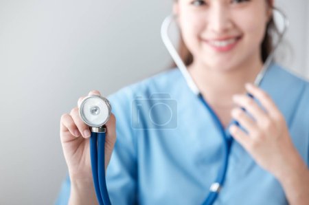 Portrait of asian young f nurse using stethoscope in hospital. Concept Of Medical Technology and Healthcare Business. High quality photo