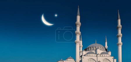 Photo for Ramadan concept - Ramadan kareem. Tall minarets, mosque dome and crescent and shining star in the sky. Religious background image. - Royalty Free Image