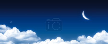 Photo for Crescent moon above the clouds. Panoramic dark blue night sky view. Ramadan concept the appearance of the crescent. - Royalty Free Image