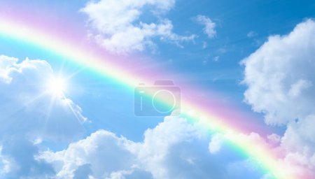 View of rainbow in sunny sky after rain.