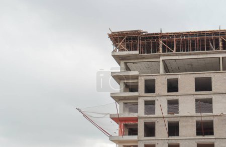 Multi-storey building under construction with safety net installed