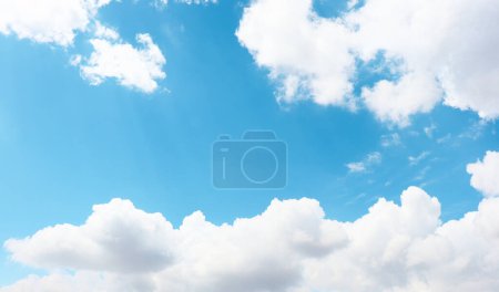 Natural clean blue sky and cottony white clouds on summer day. Beautiful sky background photo.
