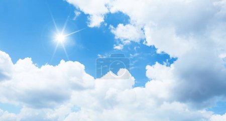 White clouds and blue sky on a sunny day. Good weather, fresh air.  Beautiful sky background photo