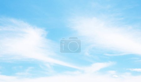 Photo for Wispy cirrostratus clouds. Sheet-like thin clouds covering the blue sky. - Royalty Free Image