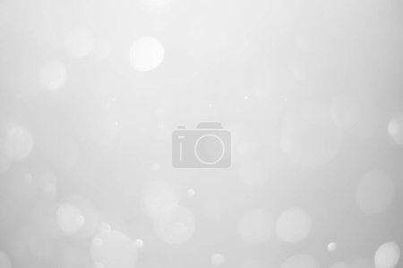 Téléchargez les photos : White glitter vintage lights background.  White bokeh shiny on dark background. - en image libre de droit