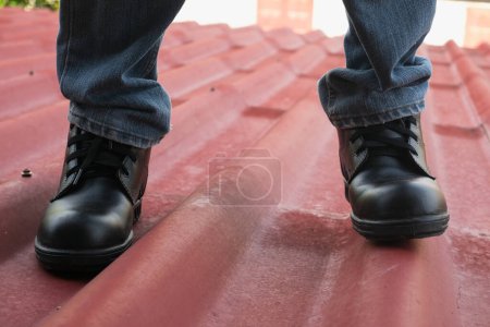 Photo for Wear safety shoes to ensure safety at work. construction workers wear safety shoes. People with factory safety concept - Royalty Free Image
