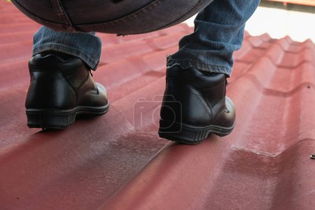 Photo for Wear safety shoes to ensure safety at work. construction workers wear safety shoes. People with factory safety concept - Royalty Free Image