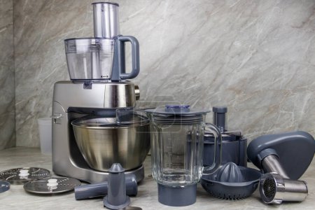 Modern kitchen machine with different attachments and accessories