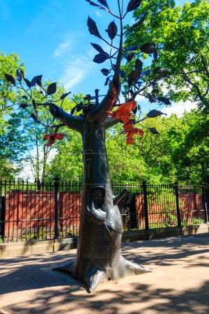 Photo for Kronstadt, Russia - June 25, 2019: Iron wish tree in Kronstadt, Russia. Cast-iron sculpture in a shape of a tree with large ears and a smile - Royalty Free Image