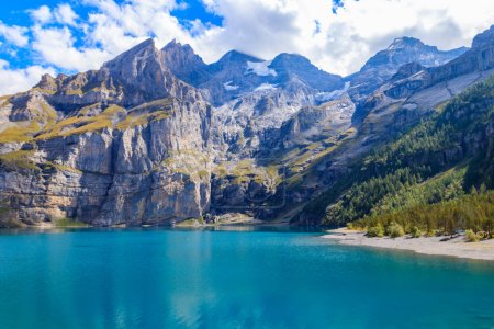 Photo for View of Oeschinen lake (Oeschinensee) and Swiss Alps near Kandersteg in Bernese Oberland, Switzerland - Royalty Free Image
