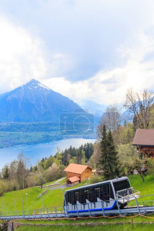 Funicular to the Niederhorn mountain with view of Lake Thun and Niesen mountain in Switzerland