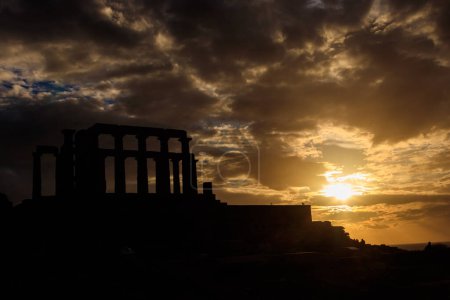 Photo for Greece Cape Sounio. Ruins of an ancient temple of Poseidon, Greek god of the sea, on sunset.Tourist landmark of Attica, Sounion, Greece - Royalty Free Image