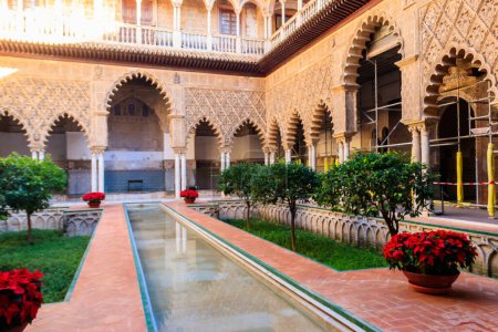 Patio de las Doncellas in Royal palace, Real Alcazar (built in 1360) in Seville, Andalusia, Spain. Real Alcazar is iconic and famous Moorish royal palace