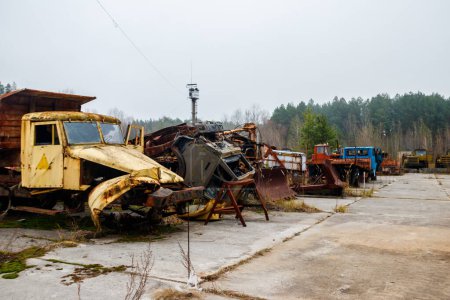 Old rusty abandoned damaged trucks in Chernobyl exclusion zone, Ukraine