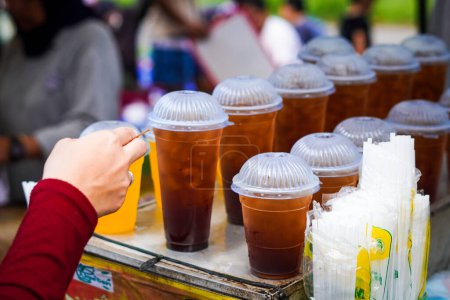 Indonesian ice tea in plastic cup.