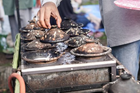 Street Food Delight. Making Serabi Pancakes on Traditional Stove