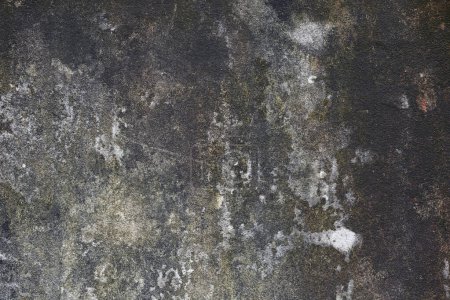 Grunge texture. Weathered concrete wall with cracks and stains.
