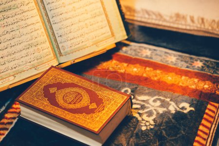 The Quran, the holy book of Islam, is placed on a prayer mat.