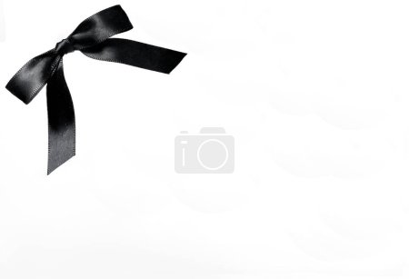 Photo for Concolence Concept with Noble Black Mesh Loop Shiny Wide Ribbon on White Background Means Loss Funeral Death Condolence Grief Loss Funeral - Royalty Free Image