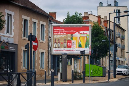 Photo for Dordogne, France July 02 2023: "Auchan" Brand Billboard Advertising Local Beer - Royalty Free Image
