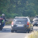 Dordogne, France July 23 2023: Motorcyclist Overtaking a Car, Road Safety Emphasized