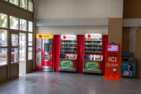 Photo for Perigueux, France October 23, 2023: Coffee, Snack and Beverage Vending Machines with Job Kiosk and Copier in Train Station Hall - Royalty Free Image